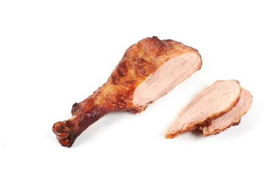 roast turkey leg and sliced turkey meat isolated on white background.
