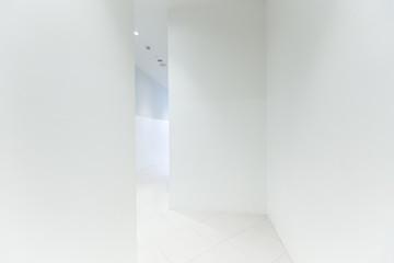 Office corridor with large blank wall