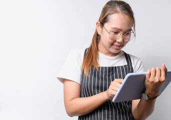 Young Asian woman The restaurant owner concept on white background using tablet for business concept, business concept with copy space