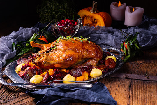 roast duck with potato dumplings and plums