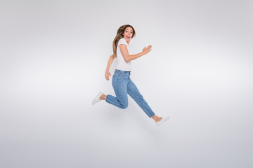 Fototapeta na wymiar Full length body size photo of girlfriend running forward looking into camera while isolated with white background