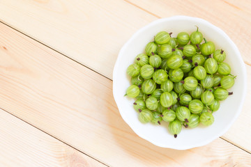 Summer harvest of gooseberries. Background with copy space.