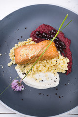 Steamed salmon steak served with pasta