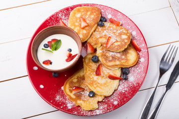 Pancakes with berries and cream