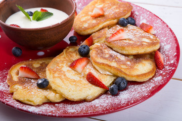 Pancakes with berries and cream