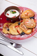 Pancakes with berries and cream