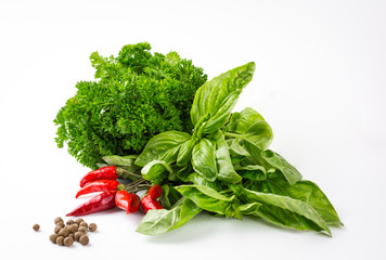 Parsley, chili, basil and black pepper on the white background studio shot, ingredients