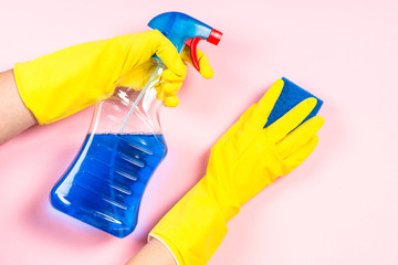 Woman cleaning pink surface.