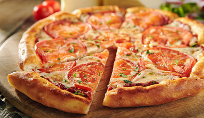 Pizza Restaurant Menu - Delicious Fresh Margarita Pizza with. Pizza on Rustic Wooden Table with...