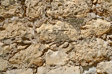 Détail de mur de pierre ancien.