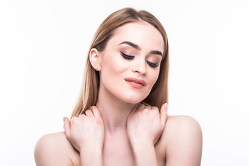Close-up portrait of beautiful young woman with healthy clean skin touching her face on white background