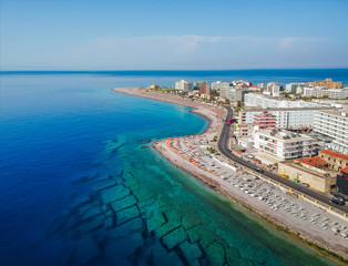 Aerial birds eye view drone photo of Elli beach on Rhodes city island, Dodecanese, Greece. Panorama with nice sand, lagoon and clear blue water. Famous tourist destination in South Europe