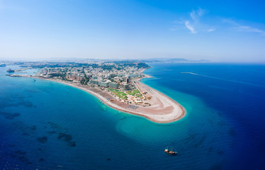 Aerial birds eye view drone photo of Elli beach on Rhodes city island, Dodecanese, Greece. Panorama with nice sand, lagoon and clear blue water. Famous tourist destination in South Europe - obrazy, fototapety, plakaty