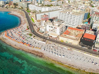 Aerial birds eye view drone photo of Elli beach on Rhodes city island, Dodecanese, Greece. Panorama with nice sand, lagoon and clear blue water. Famous tourist destination in South Europe