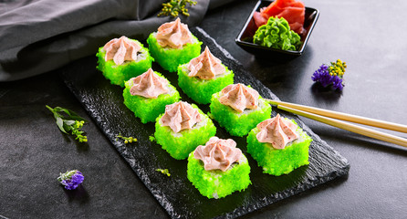 Roll with tobiko caviar and cheese and caviar sauce