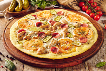 Homemade pizza on wooden table top view