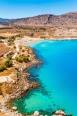 Sea skyview landscape photo of Agia Agathi beach near Feraklos castle on Rhodes island, Dodecanese, Greece. Panorama with sand beach and clear blue water. Famous tourist destination in South Europe