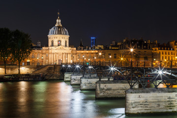 Fototapeta na wymiar Night panoramic cityscape of Seine river and Paris, France, Europe. Seine is famous tourist destination with many landmarks. View of Seine postcard in Paris