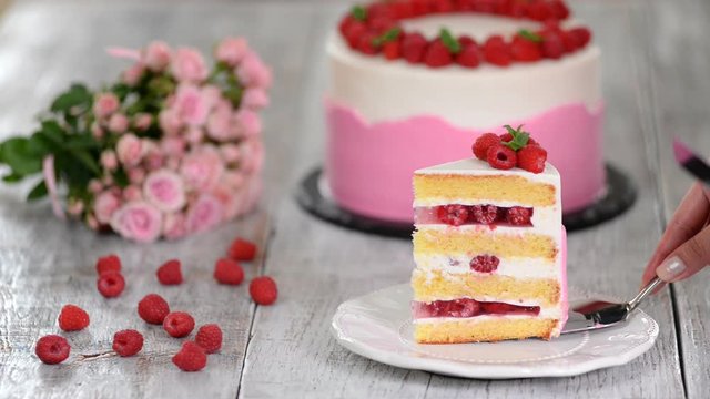 Piece of raspberry cake in a white plate