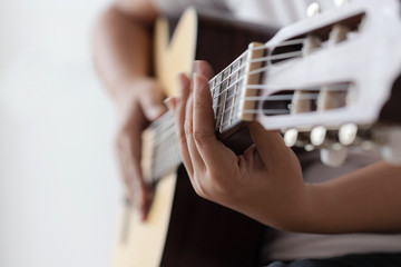 Woman hands playing acoustic classic guitar the musician of jazz and easy listening style select focus shallow depth of field and motion blur technique