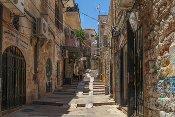 Narrow street in the Jerusalem old city, Israel with traditional houses.