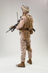 Rear view of military soldier US army marines operator studio shot portrait