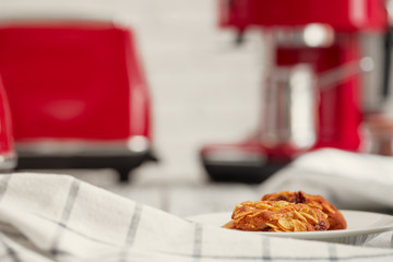 Cookies in a plate on kitchen counter close up