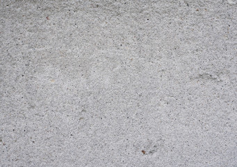 Cement and Concrete texture for pattern and background.  Grungy wall background with cracks, stones and paint. 