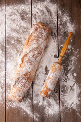 Hot french bagette on roustic wrap in boulangerie. Bred, food, closeup