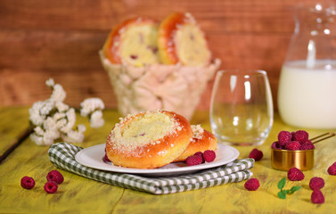 Fresh homemade open patties with cottage cheese. Traditional Russian pastry vatrushka, round buns with raspberries.