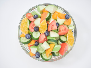 Mixed fruit and vegetable salad in a glass bowl