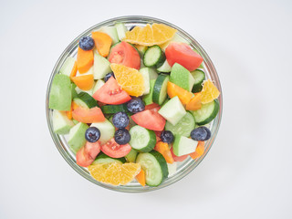 Mixed fruit and vegetable salad in a glass bowl