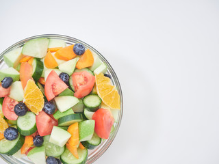 Mixed fruit and vegetable salad in a glass bowl