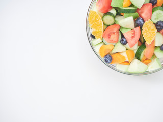 Mixed fruit and vegetable salad in a glass bowl