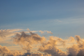 Dramatic golden blue sunset or sunrise with clouds.