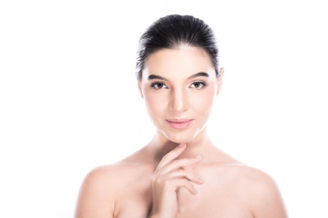 Naklejka premium Beauty woman face isolate in white background. Young caucasian girl, perfect skin, cosmetic, spa, beauty treatment concept. One finger on chin, smile.