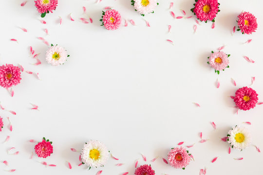 Frame made of pink and white flowers on white background. Valentines Day, Easter, Birthday, Mother's day. Flat lay, top view, copy space