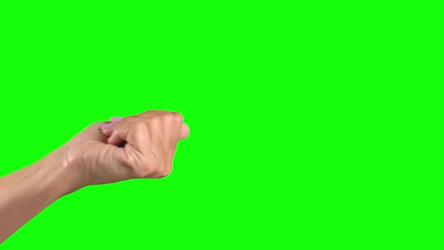 Closeup view of beautiful female hand in beckoning gesture isolated on green screen background. Real time 4k video footage.