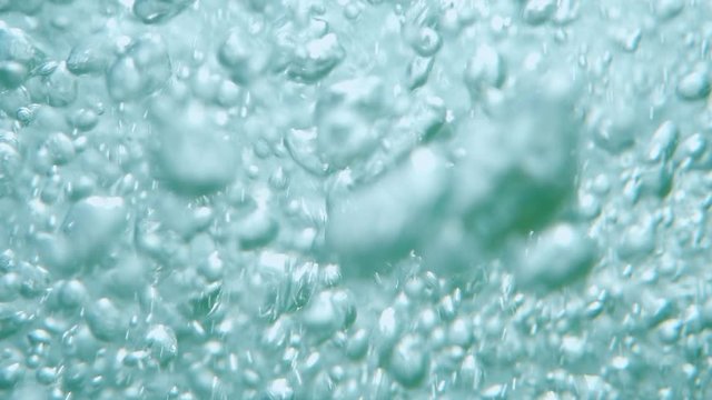 Bubbles rising to the surface. Air bubbles in water in sea (underwater shot), good for backgrounds. Slow motion.