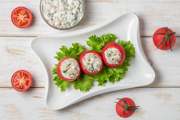 Tomatoes stuffed with shrimp. Belgian national snack. The view from the top. Copy space.