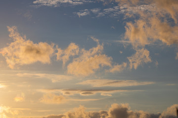 Obraz premium Dramatic golden blue sunset or sunrise with clouds.