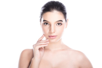 Beauty woman face isolate in white background. Young caucasian girl, perfect skin, cosmetic, spa, beauty treatment concept. Finger on cheek, jaw.