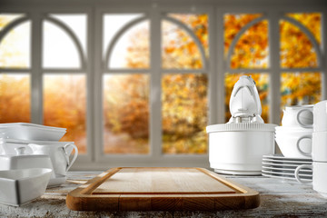 Fototapeta na wymiar White wooden board of free space for your decoration and autumn time window 