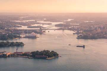 Aerial view of Sydney Harbour with Bridge and waterfront historic suburbs