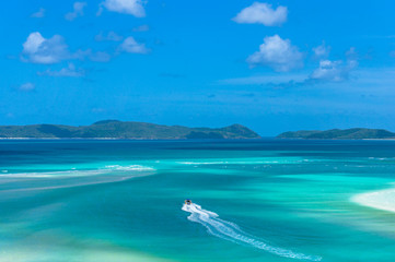 Aerial view of rafting boat on turquoise blue water