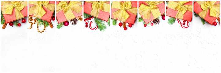 Christmas gifts. Composition collage with red gift, stars, garland, green Xmas fir branch, red holly berries and baubles on white background