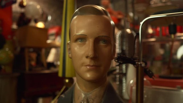 Zoom on a vintage mannequin face of a man.