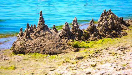 Beautiful seascape. The tower and the hills of sand.