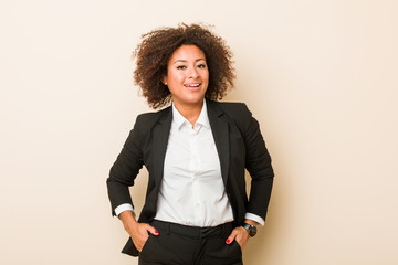 Young business african american woman confident keeping hands on hips.