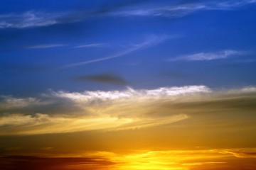 amazing unreal toned fantasy sunset or sunrise partially cloudy sky for using in design as background.